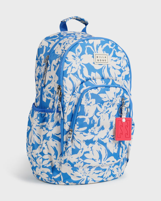 Blue and white floral patterned backpack with front pocket, dual handles, and red keychain attachment.