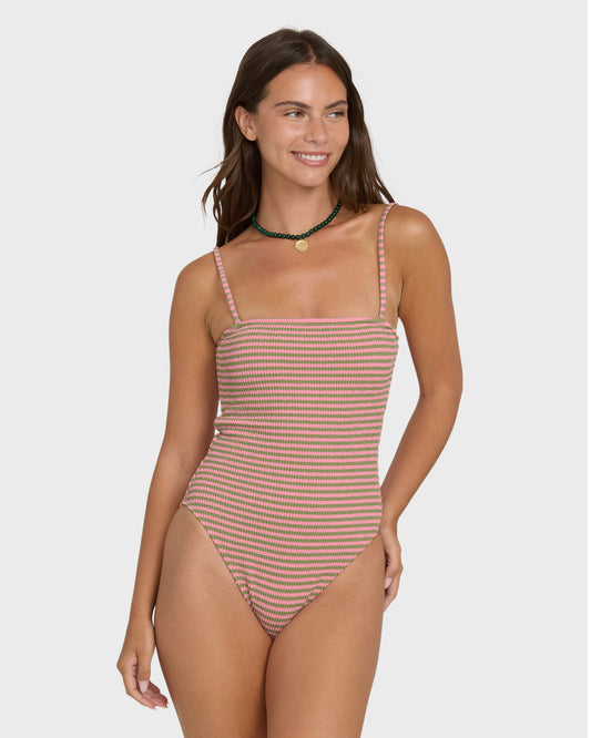 Cedar and white striped one-piece swimsuit with square neckline and thin shoulder straps on model.
