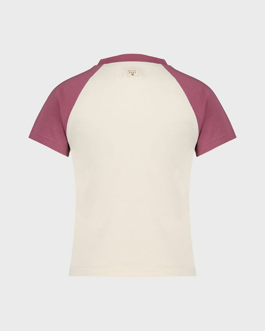 Two-tone t-shirt with maroon sleeves and cream body on a light gray background
