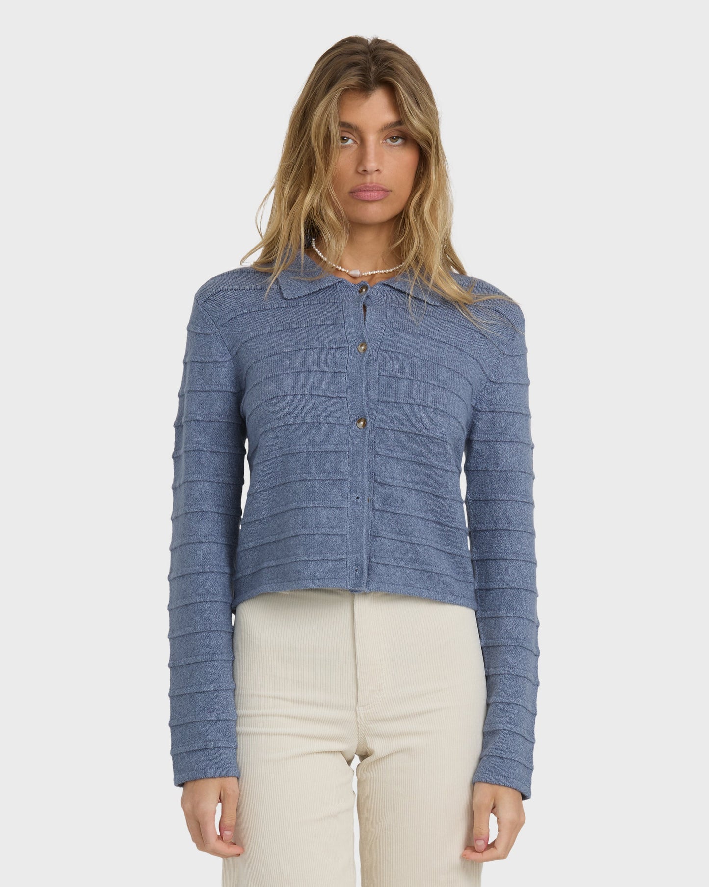Stone blue ribbed cardigan with button front and long sleeves.