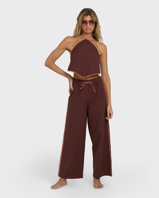 Teak elastic waist pants with drawstring and side stripe, paired with matching halter crop top.
