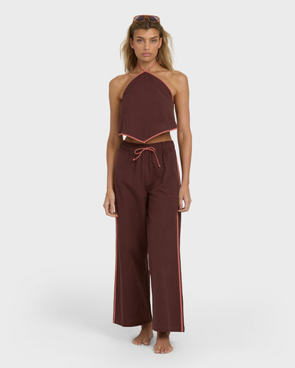 Teak elastic waist pants with drawstring and side stripe detail, styled with matching halter crop top.
