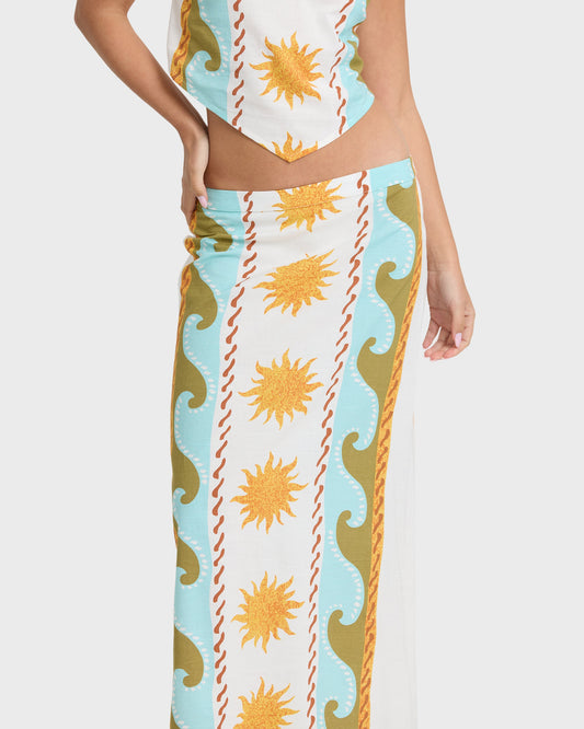 Midi skirt with sun and wave print in cream, light blue, gold, and red stripes.
