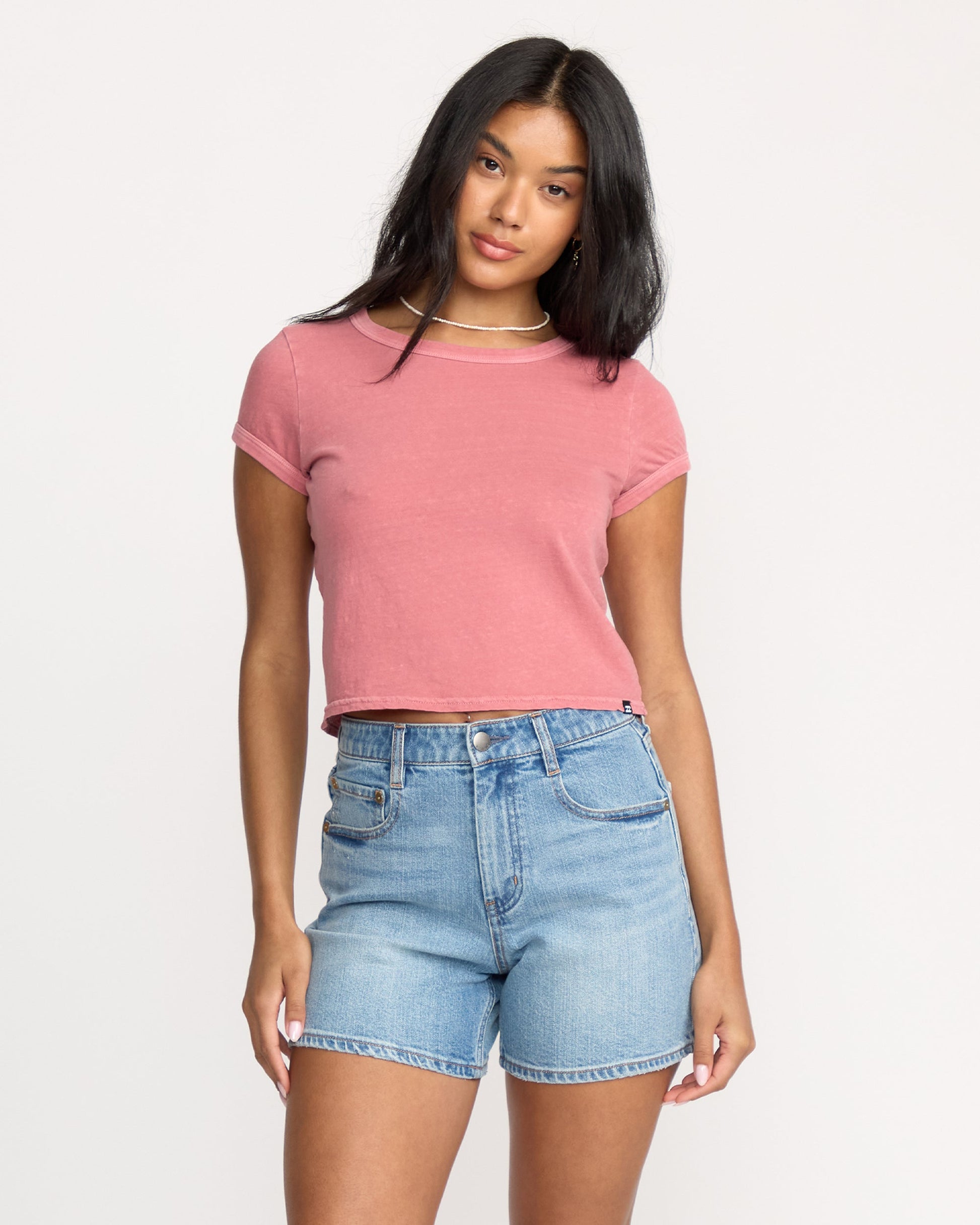 Light blue denim shorts with shaded wash, five-pocket styling, and frayed hem.