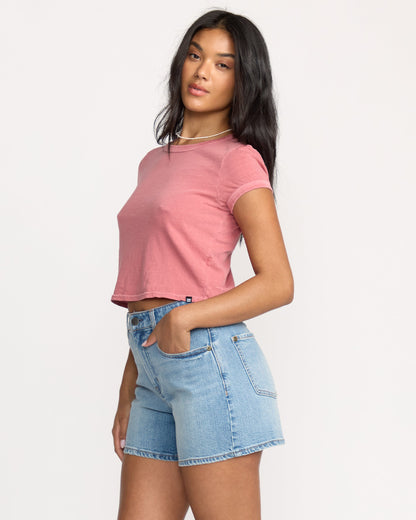 Light blue denim shorts with shaded wash and front pockets, styled with pink cropped t-shirt.