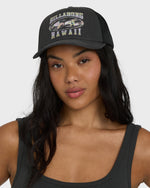 Black trucker hat with mesh back panel and embroidered Billabong Hawaii graphic with tropical fish design on front.