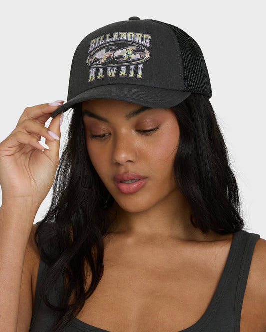 Black trucker hat with "Billabong Hawaii" embroidered text and tropical graphic on front, mesh panels on back.
