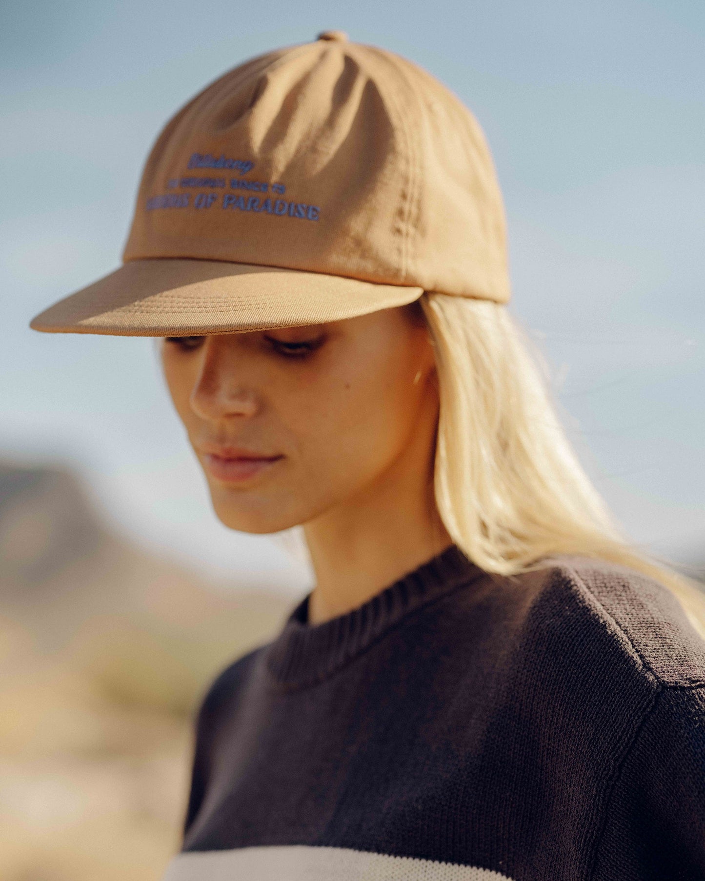 Rose brown grandpa hat with blue embroidered text on front and back panel design.