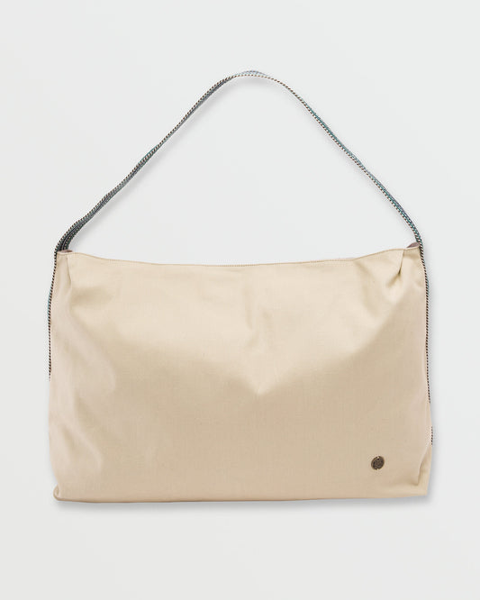 Coyote-colored shoulder bag with braided dark strap and small circular logo detail on front.