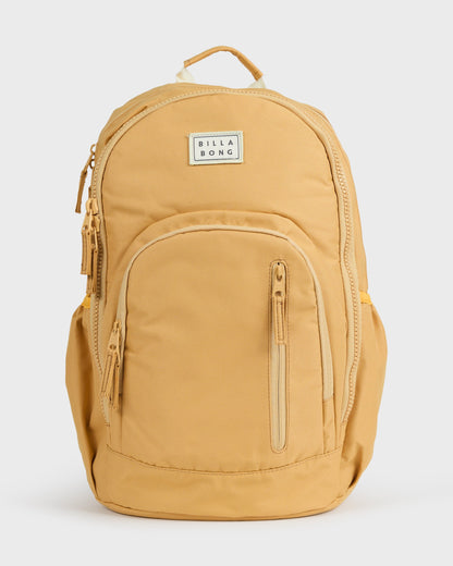 Honey-colored backpack with padded straps, front zipper pocket, and Billabong brand label.