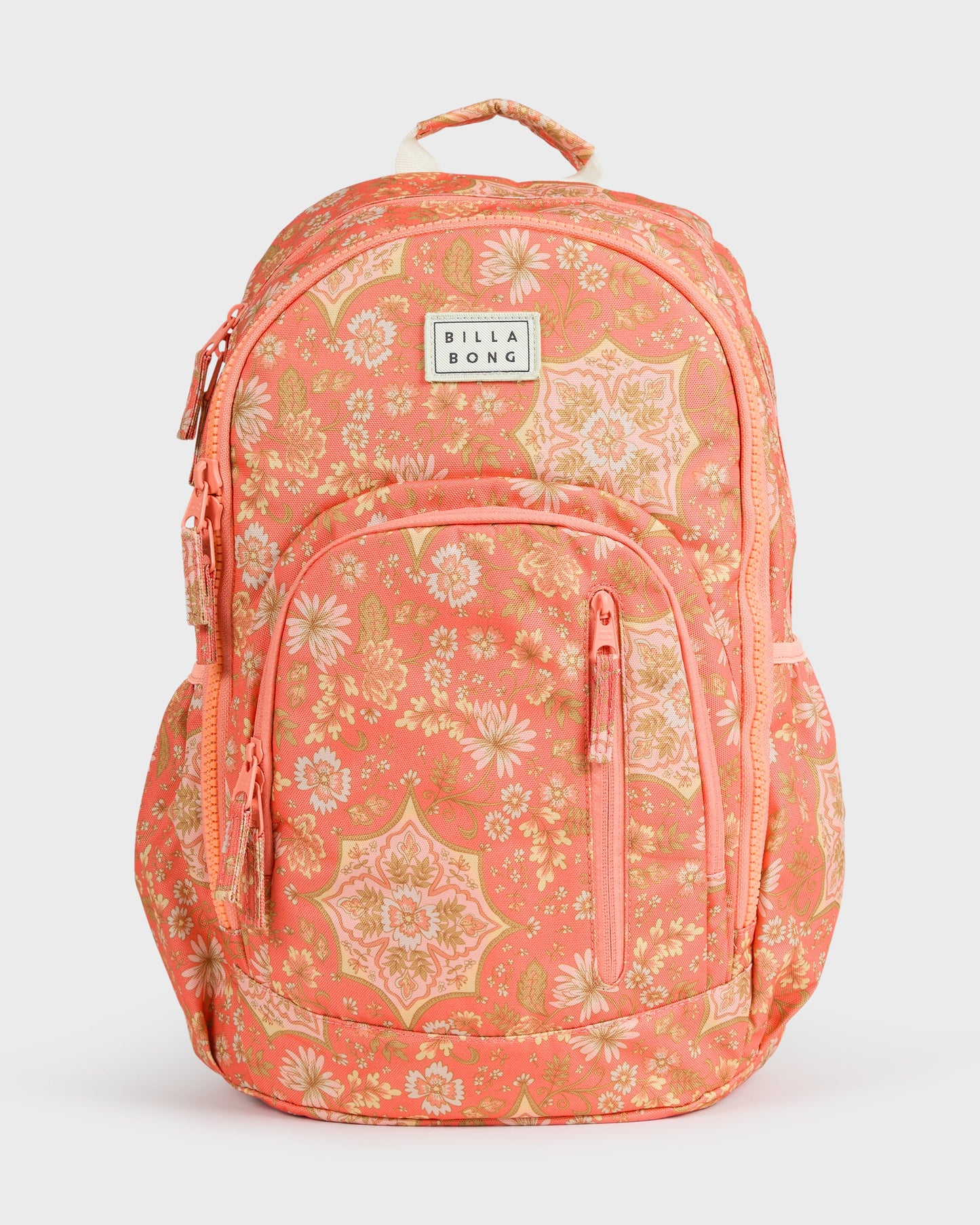 Coral backpack with floral and geometric pattern, front zippered pocket, padded straps, and Billabong logo patch.