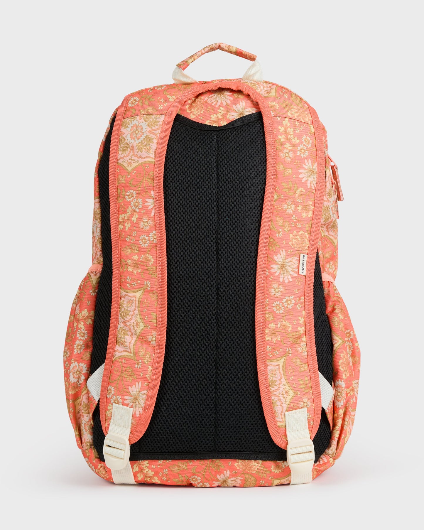 Coral backpack with yellow floral pattern, black mesh back panel, and cream-colored straps and handles.