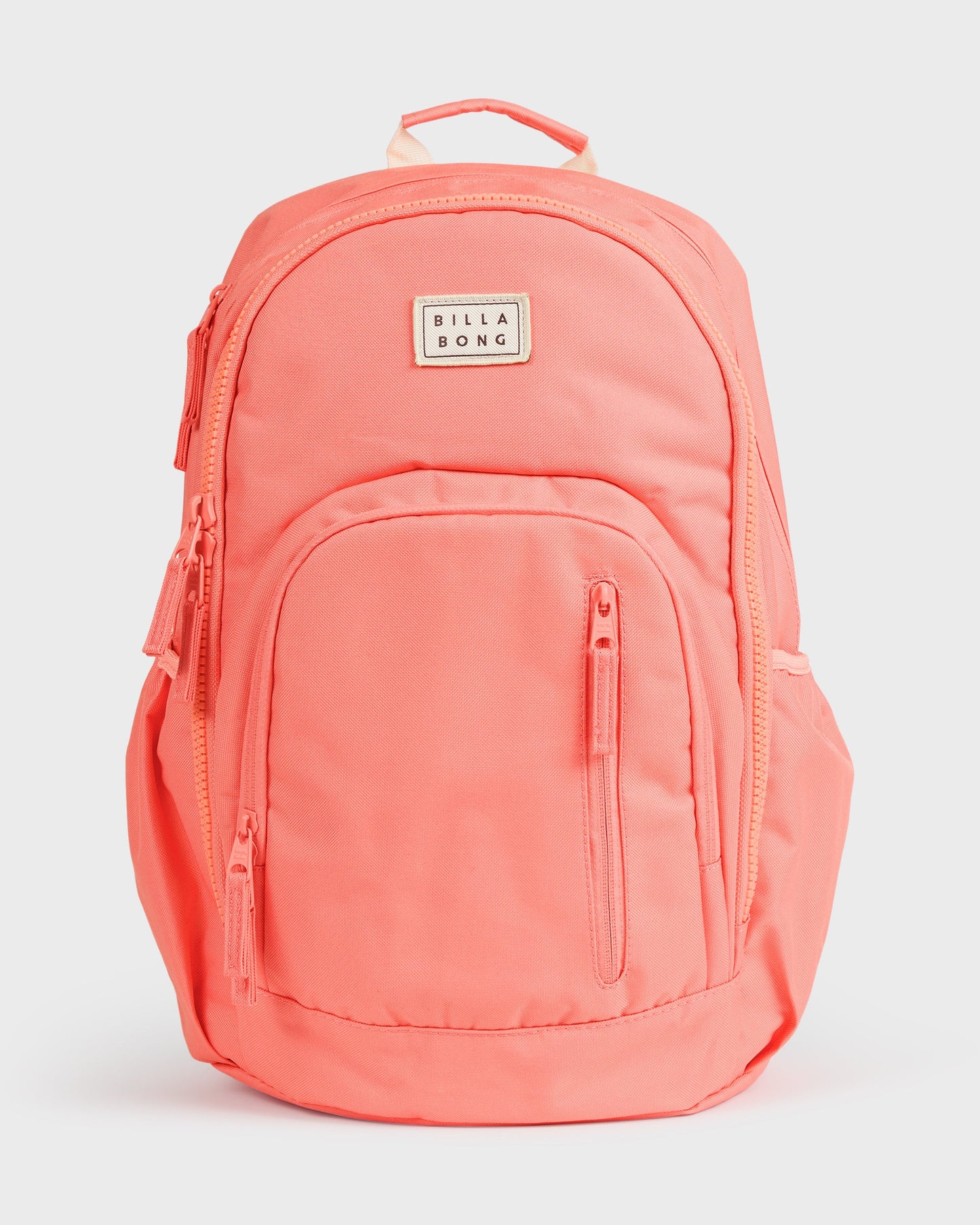 Papaya-colored backpack with padded shoulder straps, front zip pocket, and Billabong logo patch.