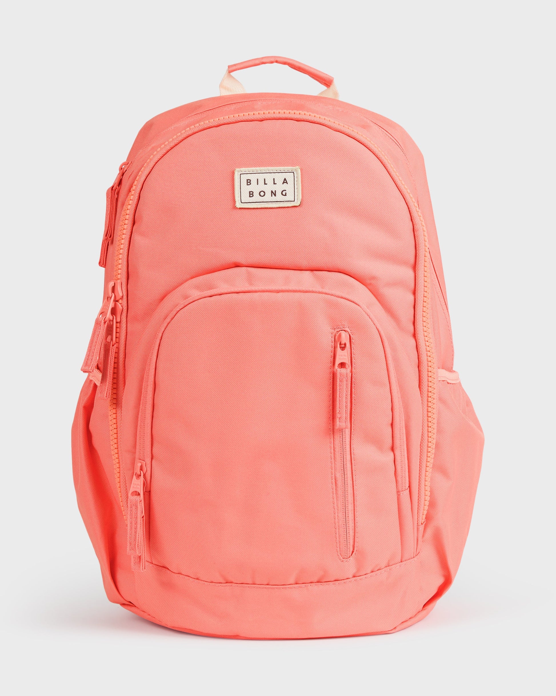 Papaya-colored backpack with padded shoulder straps, front zip pocket, and Billabong logo patch.
