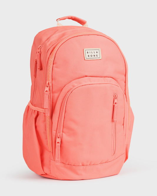 Papaya-colored backpack with multiple zippered compartments, padded straps, and Billabong logo patch.