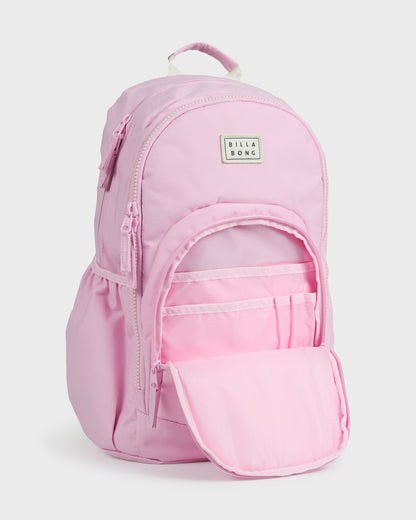 Light pink backpack with top handle, front zippered pocket open showing interior compartments, and Billabong logo patch.