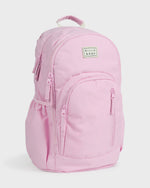 Light pink backpack with padded straps, front pocket, and Billabong logo patch on main compartment.