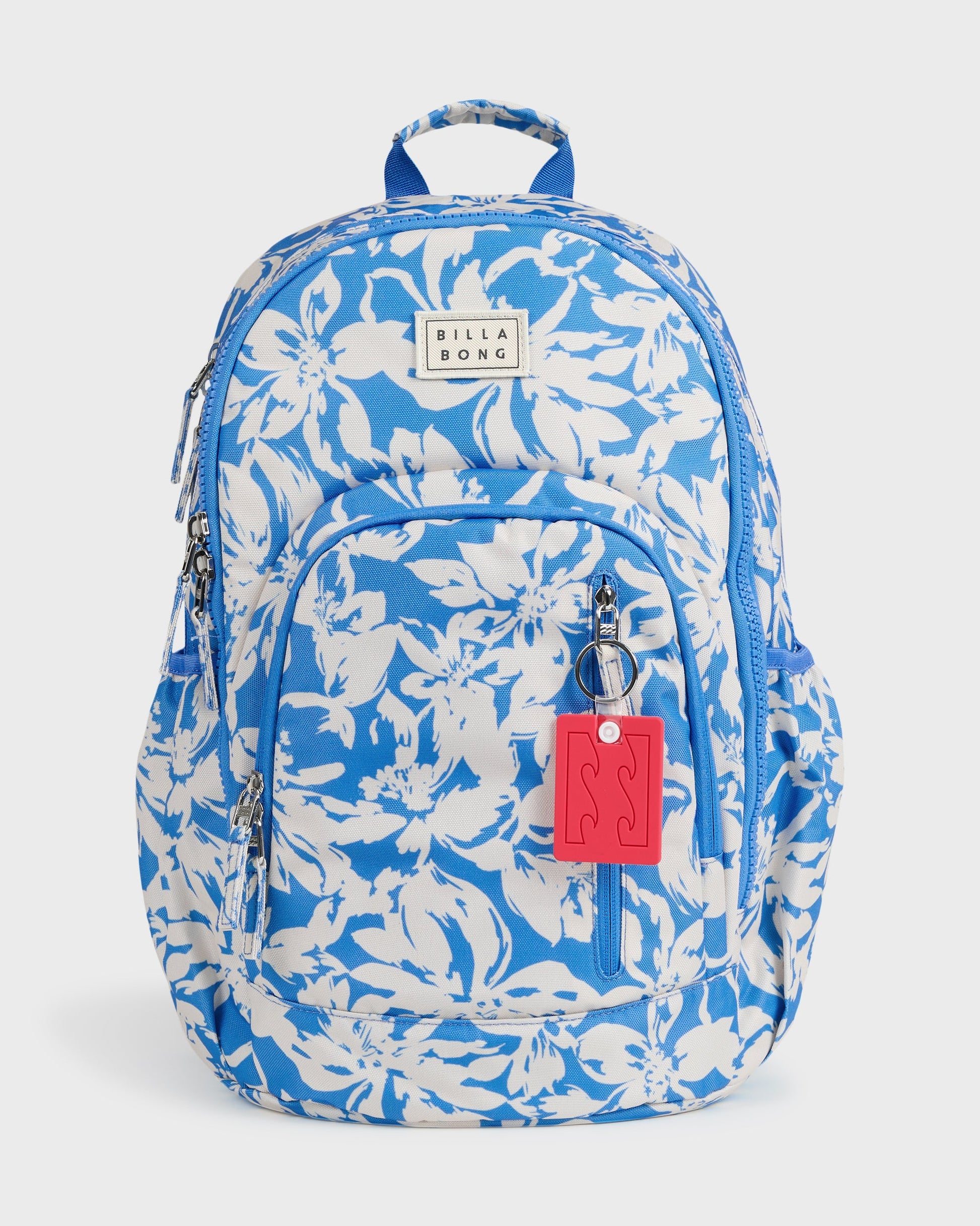 Blue and white floral patterned backpack with padded straps, front pocket, and red keychain attachment.