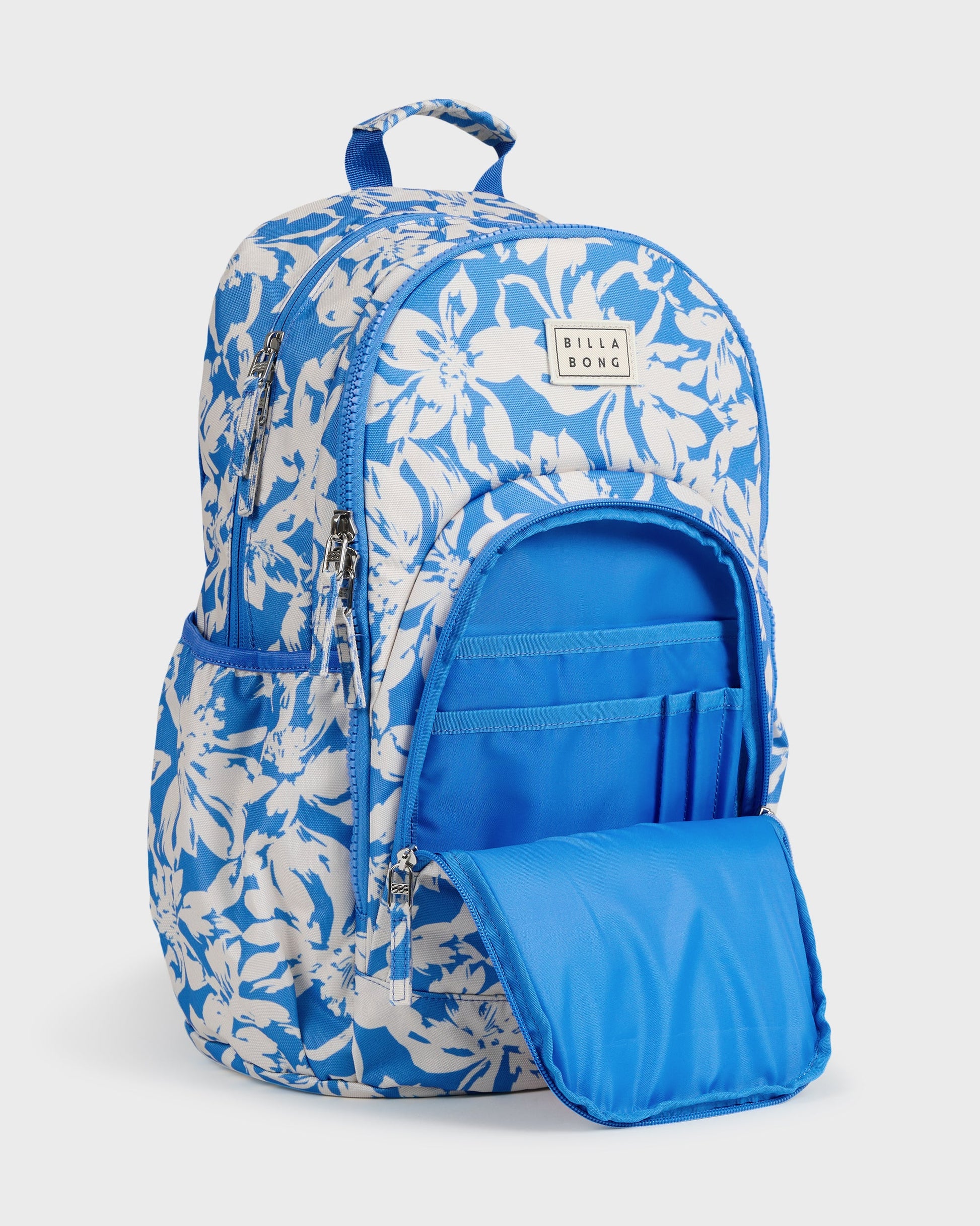 Blue and white floral backpack with front compartment open, showing interior organization pockets and solid blue lining.