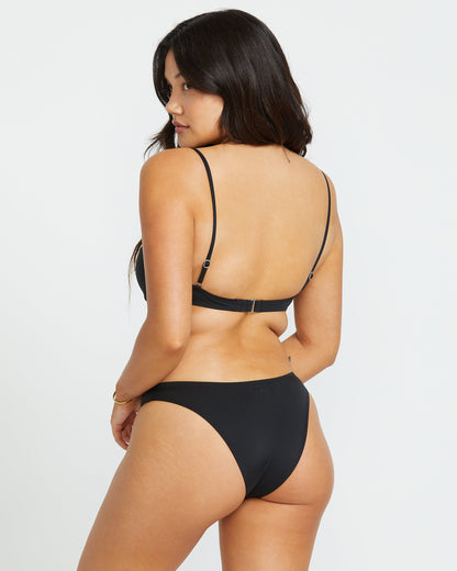 Black underwire bikini top with thin adjustable straps shown from back view on model.