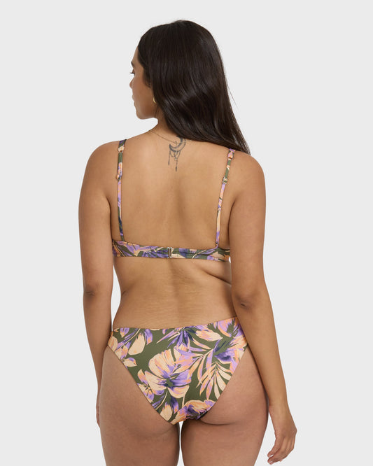 Reversible bikini bottom with tropical floral print in purple, pink, and olive green, shown from back view.