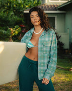 Mineral blue plaid long sleeve shirt with button front, worn open over a striped bikini top.