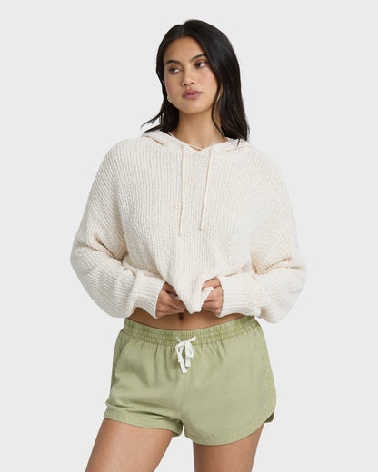 Avocado-green shorts with elastic waistband and white drawstring, paired with cream ribbed hoodie.