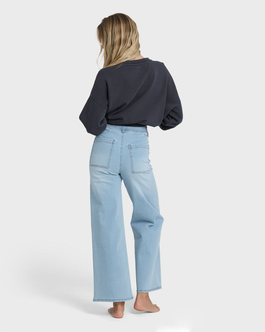 Light blue high-waist denim pants with straight-leg silhouette and visible back pockets.