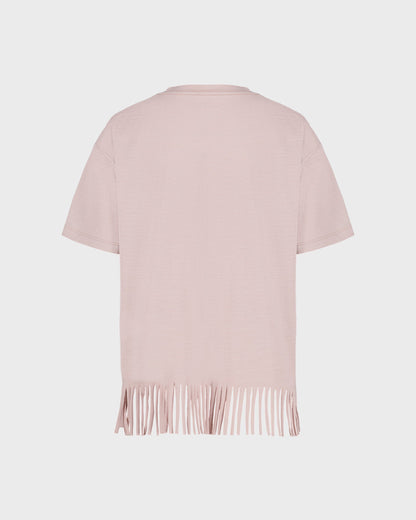 Light pink short-sleeve top with fringe details on a light gray background