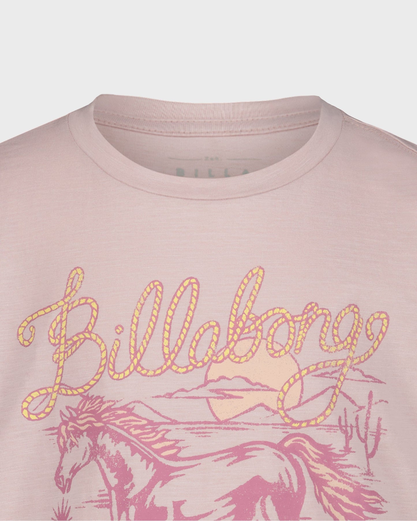 Pink t-shirt with 'Billabong' logo and horse design on a light gray background