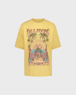 Yellow t-shirt with a colorful graphic design on a light gray background