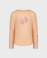 Beige sweater with floral embroidery on a light gray background