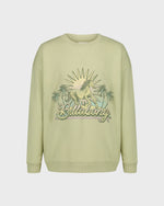Light green sweatshirt with 'Billabong' logo and palm tree design on a white background