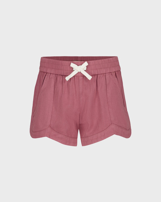Pink shorts with a white bow on a light gray background