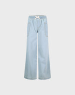 Light blue denim pants on a white background