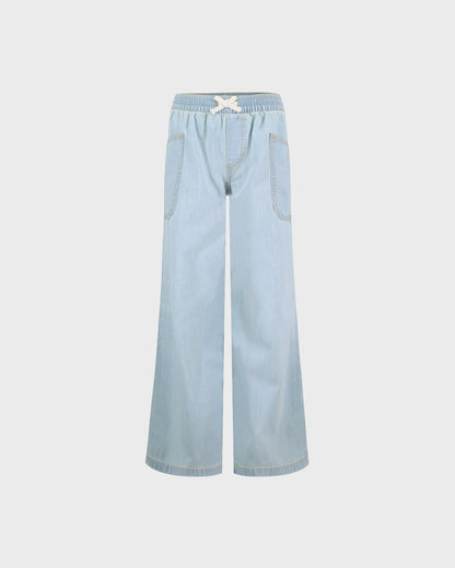Light blue denim pants on a white background