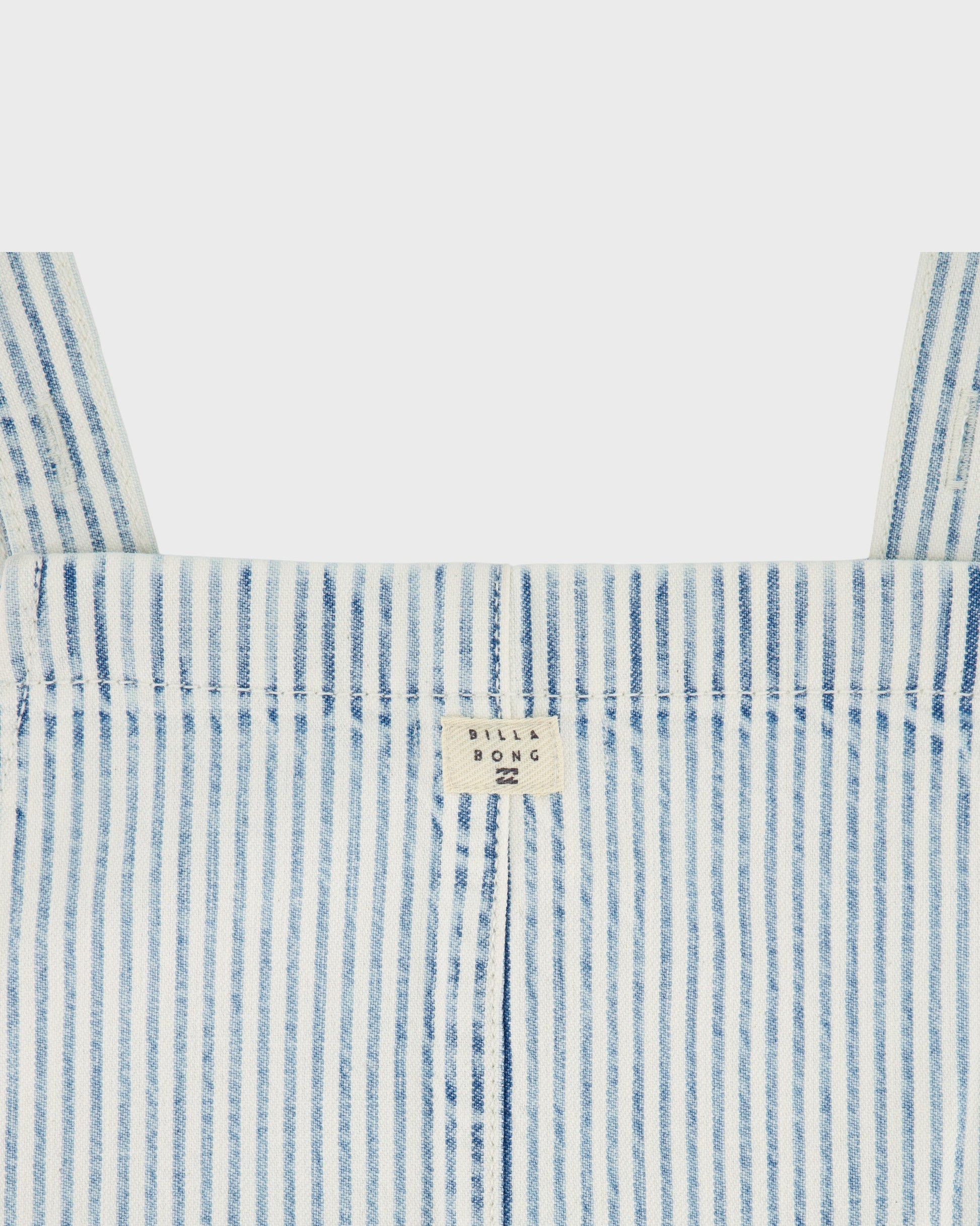 Close-up of a blue and white striped garment with a brand label on a light gray background